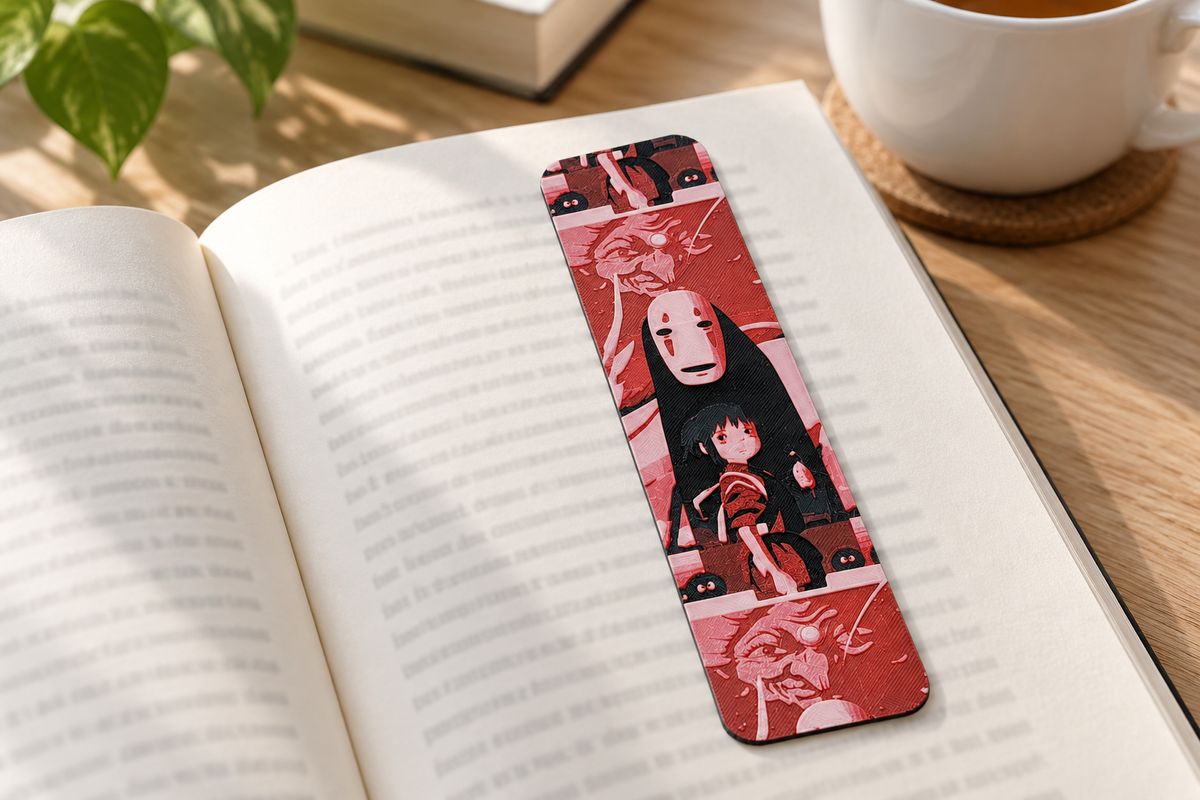 Marcapáginas Texturizado Chihiro sobre un libro abierto junto a una taza de té